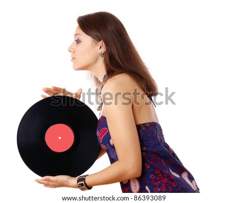 Side view of young girl posing with vinyl disk isolated on white background