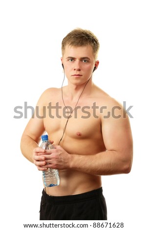 Portrait of a young sportsman with a bottle of water, isolated on white background