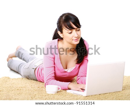 stock photo Casual barefoot girl using laptop at home isolated on white 