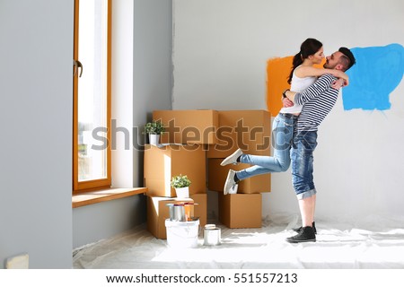 Happy young couple moving in new house