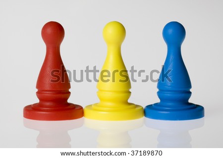 Three game pieces in a row, primary colors: red, yellow, and blue.