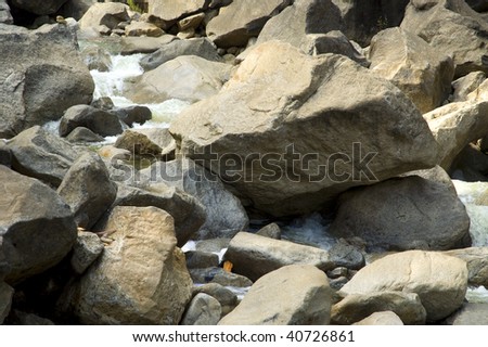Water flowing through rocks, detail, at the base of Yosemite Falls.