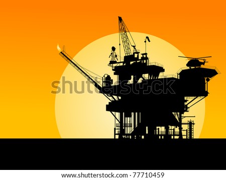 Silhouette of an oil platform in the sunset