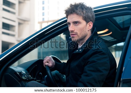 Young elegant man portrait with luxury car.