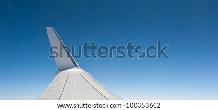 Plane wing with sky background with copy space.