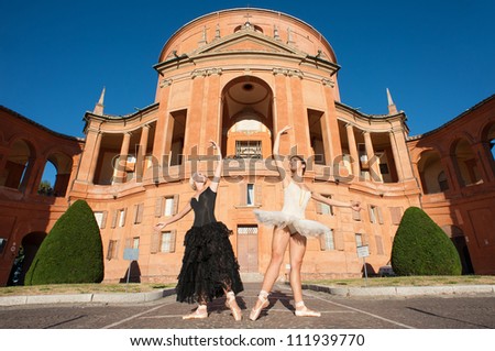 Young beautiful dancers in front of San Luca church. Bologna, Italy. Ballerina Project.