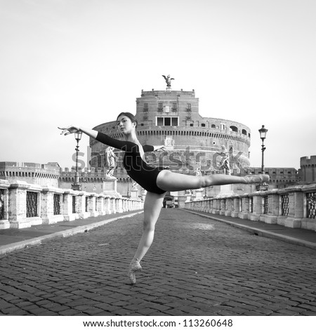Young beautiful ballerina dancing out in the street in Castel Santangelo bridge in Rome, Italy. Black and white image. Ballerina Project.