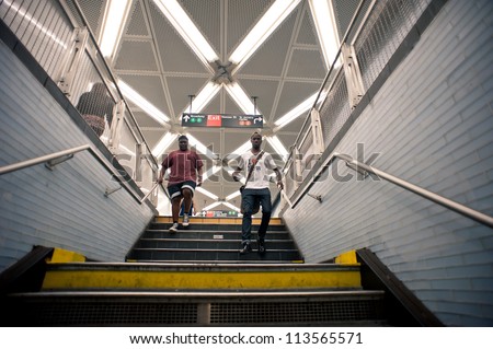 NEW YORK CITY - JUNE 28: People walk in Fulton Street subway station, on June 28, 2012 NY. This station is the twelfth busiest in the system as of 2011 with 17,971,983 passengers.