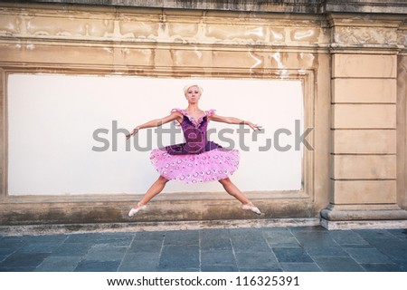 Young beautiful ballerina jumping in Bologna - Pincio, Italy. Ballerina project.