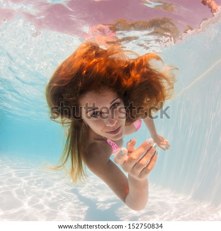 Underwater Woman Portrait In Swimming Pool.
