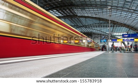 BERLIN - JUNE 2: Trains arriving at the Berlin Central train station on 2 June 2013 in Berlin, Germany. It is the is the main railway station in Berlin with a surface area of 85x120 mt.