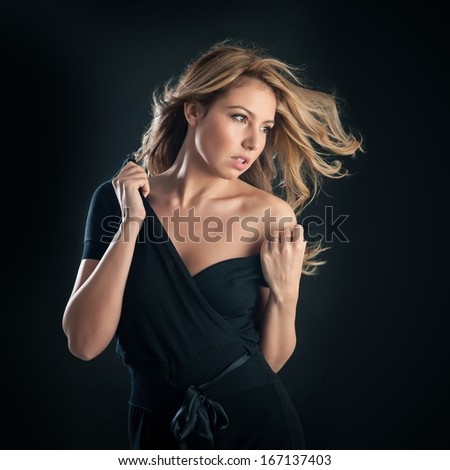 Sensual Portrait Of Blonde Woman On Black Background.
