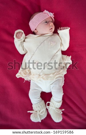 One month old baby. Full body portrait.