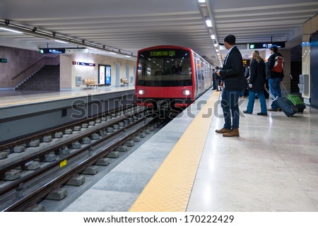 LISBON, PORTUGAL - JANUARY 1, 2014: People waiting for metro arriving. The Lisbon Metro opened in 1959, it was the first subway system in Portugal. It consists of 4 lines and 55 stations.