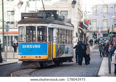 LISBON, PORTUGAL - JANUARY 5, 2014: Traditional yellow tram in Lisbon City. The Lisbon tramway network is in operation since 1873, it presently comprises five urban lines.