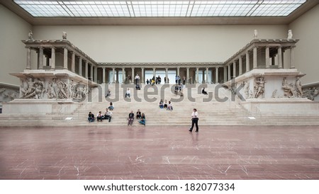 BERLIN - JUNE 3, 2013: Tourists inside the Hall of Pergamon museum, the most visited in Berlin. It hosts more than 1.5 million visitors per year.