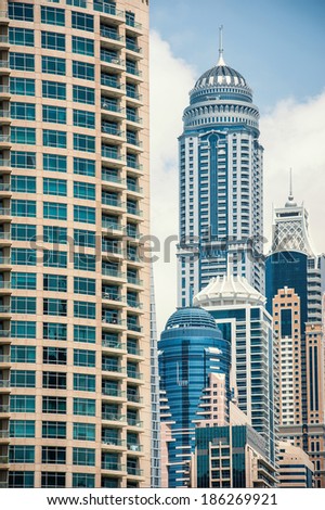 DUBAI, UAE - MARCH 27, 2014: Buildings of Dubai Marina. Dubai Marina is an artificial 3 km canal carved along the Persian Gulf shoreline.
