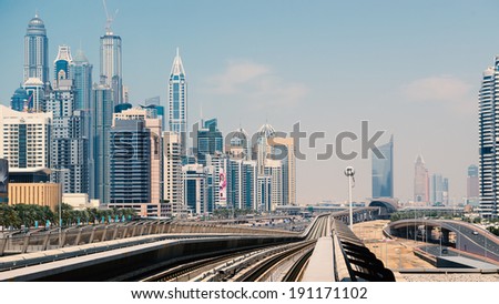 DUBAI, UAE - MARCH 28, 2014: Jumeirah Lakes Tower metro station. The JLT is a large development which consists of 79 towers being constructed along the edges of 4 artificial lakes.