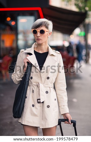 Young woman portrait walking in Paris, France.