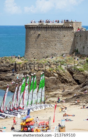 SAINT MALO, FRANCE - AUGUST 4, 2014: Tourists visiting the city. Saint-Malo is a walled port city in Brittany in northwestern France on English Channel.