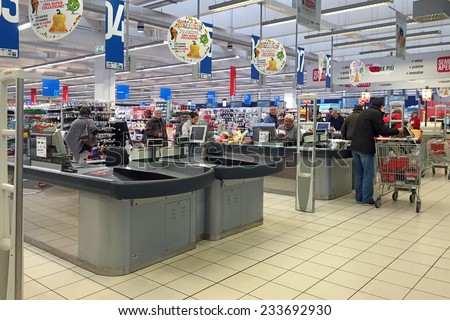 BOLOGNA, ITALY - NOVEMBER 27, 2014: Queue of people inside Coop Supermarket. Coop is the main actor on the Italian market by supermarket chains.