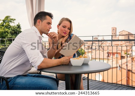 Attractive casual young at the restaurant in hotel terrace.