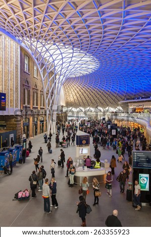 LONDON - APRIL 13, 2013: People walking inside King's Cross railway station. The annual rail passenger usage between 2011 - 2012 was 27.874 million.