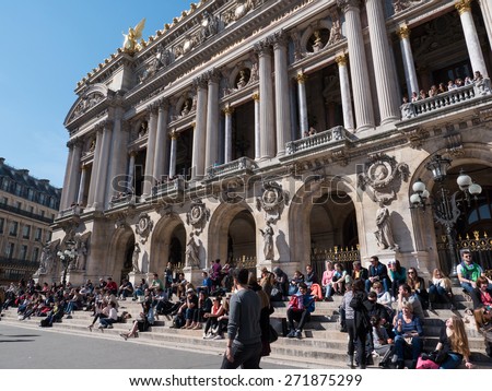 PARIS, FRANCE - APRIL 7, 2015: People in front of Paris Opera or Garnier Palace. Placed in Place de L\'Opera, it was designed by C. Garnier in 1875 in Neo Baroque Style.
