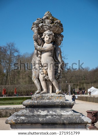 Statue inside the garden of Vaux le Vicomte Castle, baroque French Palace located in Maincy, near Paris. Constructed from 1658 to 1661 for Nicolas Fouquet, the superintendent of finances of Louis XIV.