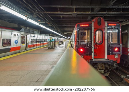 NEW YORK CITY - MAY 6, 2015: Train at platform inside Grand Central Station. The terminal is the largest train station in the world by number of platforms having 44.