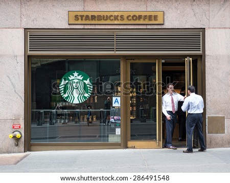 NEW YORK CITY - CIRCA MAY 2015: People in front of Starbucks store close to Grand Central Station. Starbucks is the largest coffeehouse company in the world.