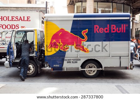 NEW YORK CITY - MAY, 2015: Red Bull van parked on the street. Red Bull is an energy drink sold by Austrian company Red Bull GmbH, created in 1987, the highest selling energy drink in the world.