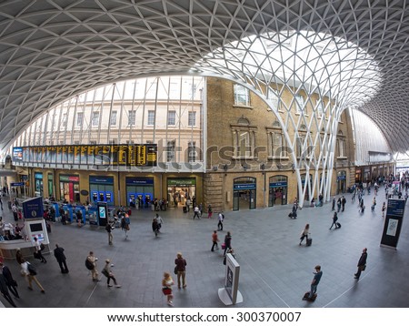 LONDON - JUNE 17, 2015: People inside King\'s Cross railway station, a major London railway terminus which opened in 1852 on the northern edge of central London.