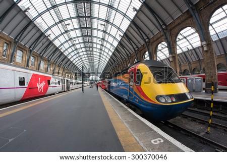 LONDON - JUNE 17, 2015: Interior view of King\'s Cross railway station, a major London railway terminus which opened in 1852 on the northern edge of central London.