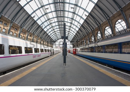 LONDON - JUNE 17, 2015: Interior view of King's Cross railway station, a major London railway terminus which opened in 1852 on the northern edge of central London.