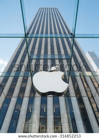 NEW YORK - MAY 13, 2015: Apple logo at the entrance of 5th Avenue store in Manhattan. As of 2014, Apple employs 72,800 permanent full-time employees, maintains 437 retail stores in fifteen countries.