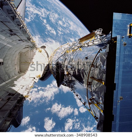 EARTH - APRIL 25, 1990: Deployment of the Hubble Space Telescope. Elements of this image furnished by NASA.