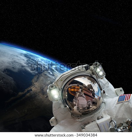 Astronaut space walking in outer space. Elements of this image furnished by NASA.