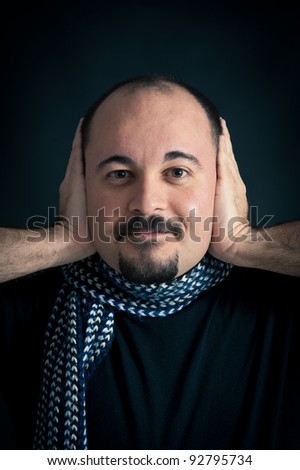 Deaf Man portrait on dark background.