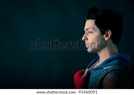 Profile of confident man with copy space against dark background