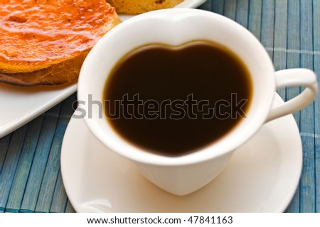 Wonderful cup of hot coffee and toast.