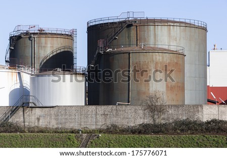 Image shows an buildup with fuel storage tanks