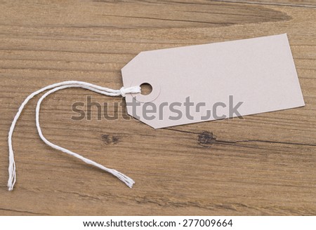 Image shows a blank label on a wooden table
