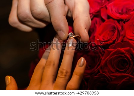 Proposal. Engagement. Love. Marriage. Love. Couple. Couple in love. Happy day. Wedding ring. Ring. Newlyweds. Roses. Holiday. Celebration. Marrige proposal. Happiness.
