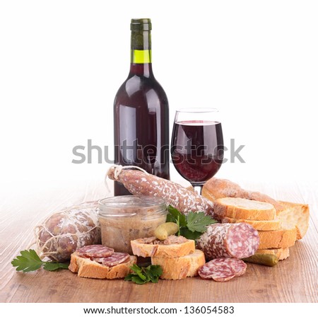 composition with wine,meat spread and sausages