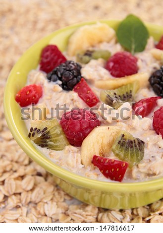 bowl of cereal, milk and fruit