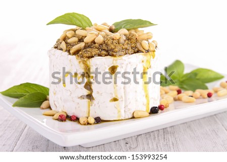 cheese with pesto sauce and pine nut