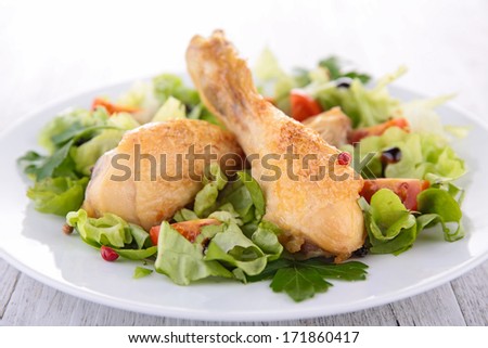 chicken leg and salad
