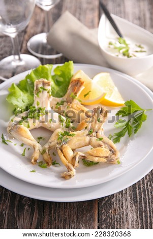 fried frog leg with parsley