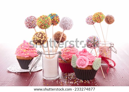 colorful cake pops and cupcake